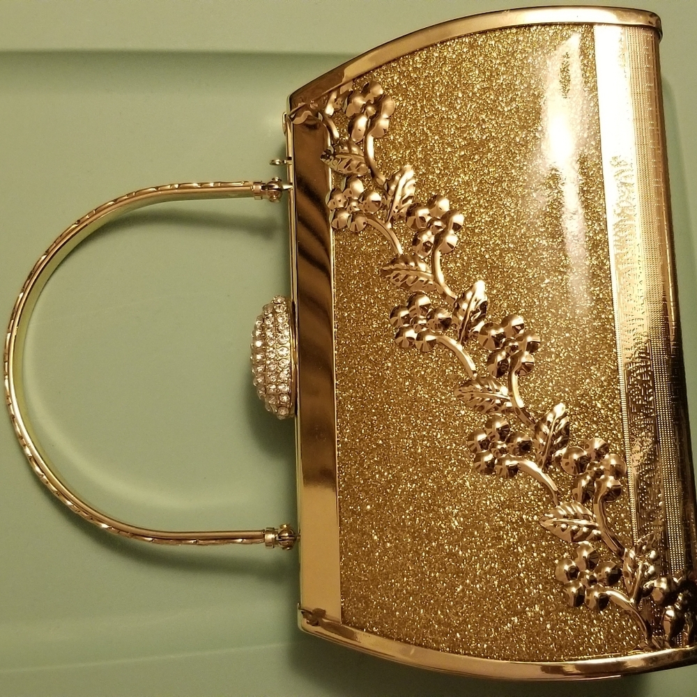 Gold Purse, hard casing, shimmering finish.